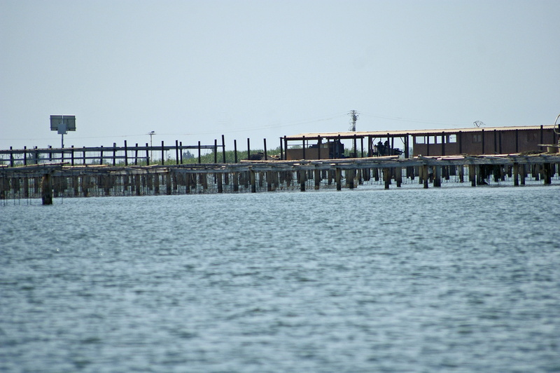 tarragona, outdoors, waterfront, horizon over water, rippled, building exterior, beauty in nature, beach, muscleras, no people, 2K, tranquility, pier