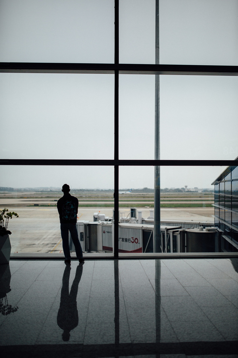 glass, full length, walking, terminal, room, architecture, person, airport departure area, waiting room, airfield, rear view, day, glass - material, air vehicle