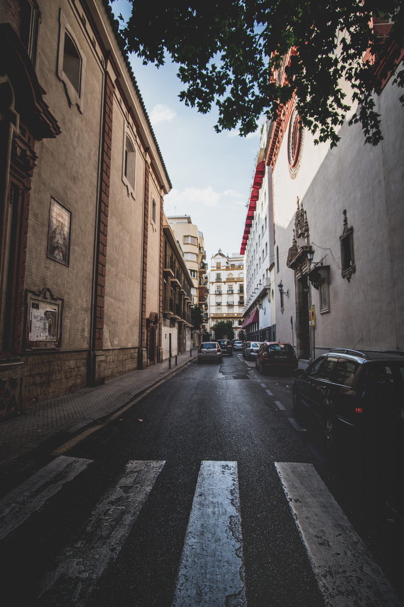 building, road, outdoors, symbol, travel, architecture, adventure, sign, tree, street photography, mode of transportation, road marking, transportation