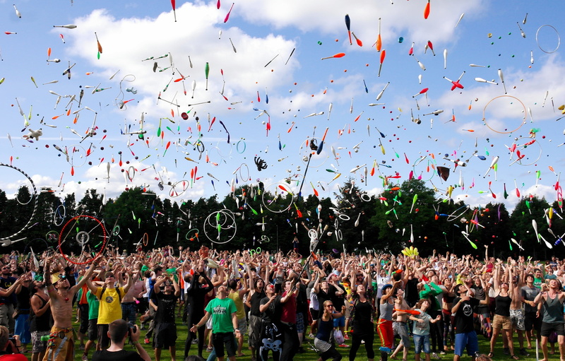 togetherness, juggle, street artists, group of people, sky, enjoyment, rings, celebration, clubs, crowd, positive emotion, juggling balls, excitement, unicycle