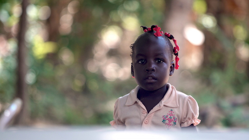 haitian, girls, bow, childhood, haitian girl, outdoors, baby, haitian child, person, contemplation, child, tree, human, real people, face, one person, offspring