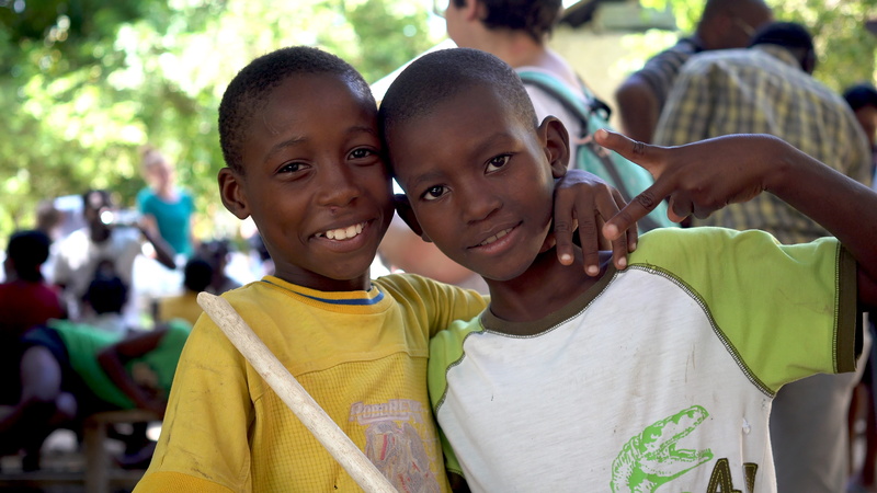 real people, incidental people, clothing, son, portrait, lifestyles, haitian boy, day, happiness, people, casual clothing, apparel, eye, haitian child