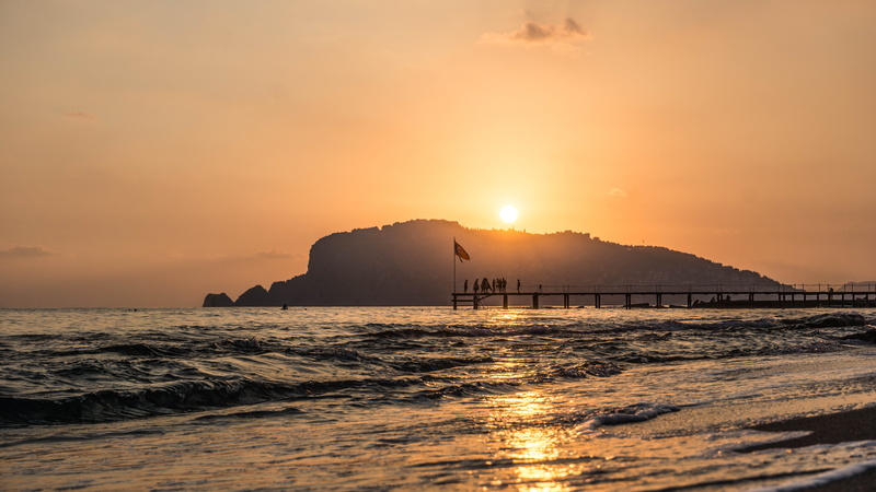 beauty in nature, sunset, no people, beach, tranquility, motion, horizon, sun, tranquil scene, scenics - nature, sky, land, rock, nature, horizon over water