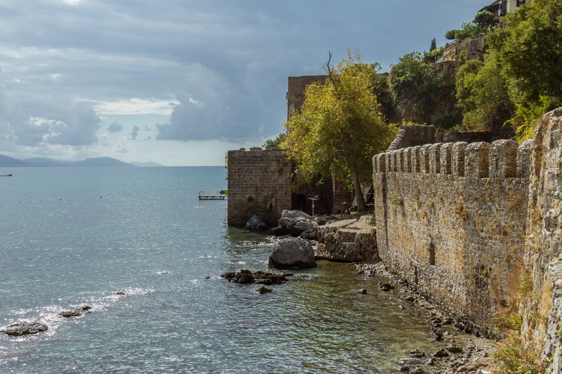 tree, beauty in nature, ruined, meditation, river, no people, alanya, the past, cloud - sky, built structure, land, tranquility, day, tranquil scene, turkish riviera