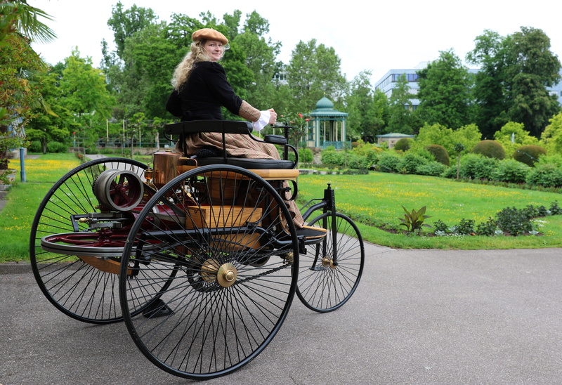 wheel, bertha benz, mercedes benz, outdoors, ride, tree, casual clothing, young adult, growth, nature, green color, plant, moorish style, leisure activity