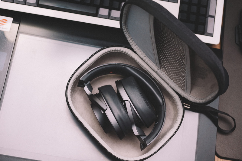 household equipment, headphones, no people, headphone, technology, indoors, pouch, sound, day, land vehicle, electronics, architecture, reflection, focus on foreground