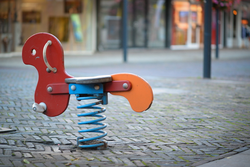 little, architecture, building exterior, animal representation, outdoors, red, street, childhood, single, happiness, day, city, play, toy, outdoor play equipment