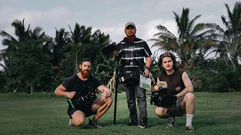 docking, grass, camera equipment, outdoors, 5K, arecaceae, tree, apparel, plant, young men, videos, video production, man, holding, people, group of people