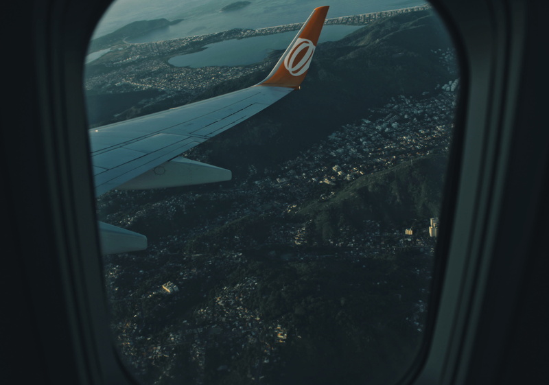 glass - material, mid-air, aircraft Wing, public transportation, sky, cityscape, mode of Transport, journey, air, no people, air Vehicle, travel, plane