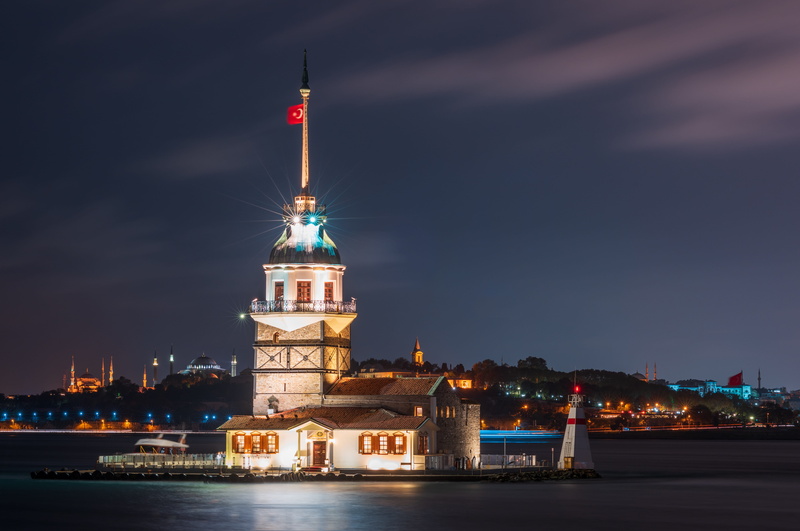 building exterior, tower, transportation system, cityscape, sky, nature, waterfront, city, illuminated, building, history, travel destinations, water, lights