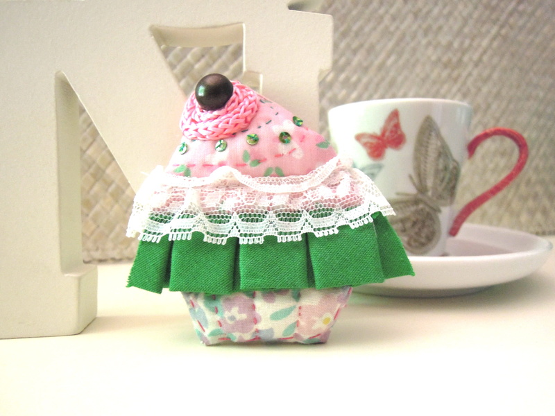 pattern, creativity, no people, indoors, cupcake, still life, brooch, tiptoe, celebration, buttons, dessert, crafts, pink color, fabric, sweet, art and craft