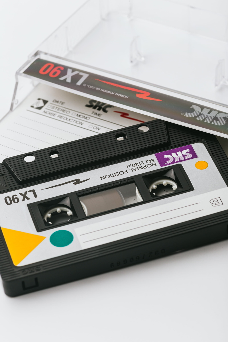 high angle view, push button, case, studio shot, arts culture and entertainment, plastic, indoors, tape, 5K, communication, control, cassette tape, black
