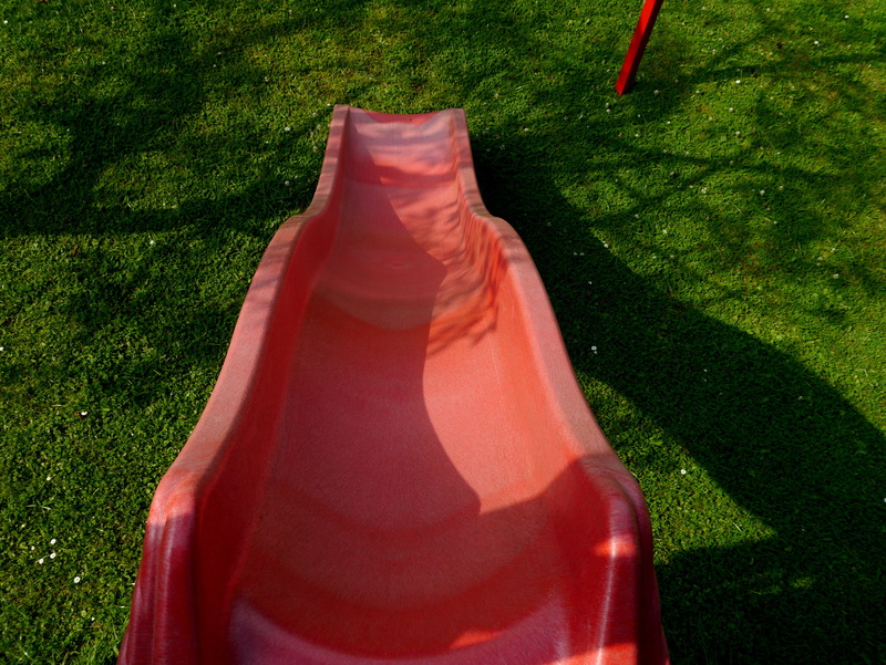 playground, red, standing, no people, park - man made space, orange color, high angle view, lawn, green color, sunlight, slide - play equipment, 4K, outdoors