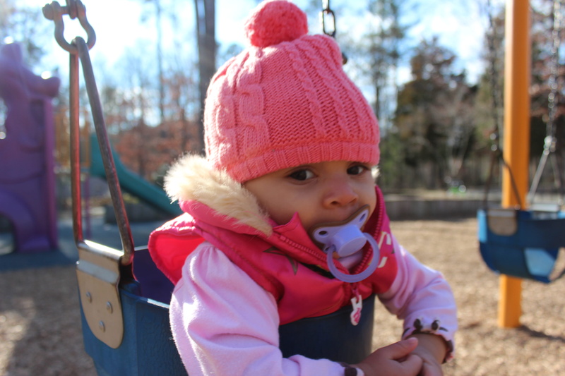 warm clothing, winter, hat, toodler, outdoors, knit hat, childhood, united states, boys, child, baby, swings, sitting, one person, playground, kids, 5K
