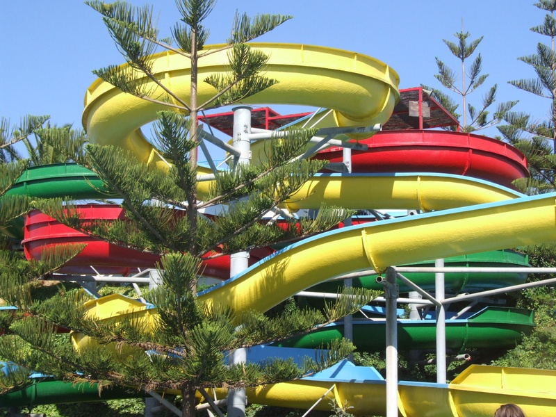 sunlight, sky, summer, tropical climate, nature, outdoors, day, amusement park ride, yellow, 2K, holidays, no people, slide, water slide, red, outdoor play equipment