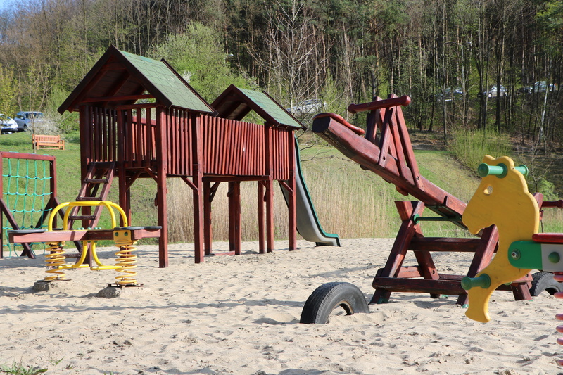 architecture, beach, plant, outdoor play equipment, 5K, built structure, transportation, jungle gym, swing, wood - material, sand, tree, building exterior