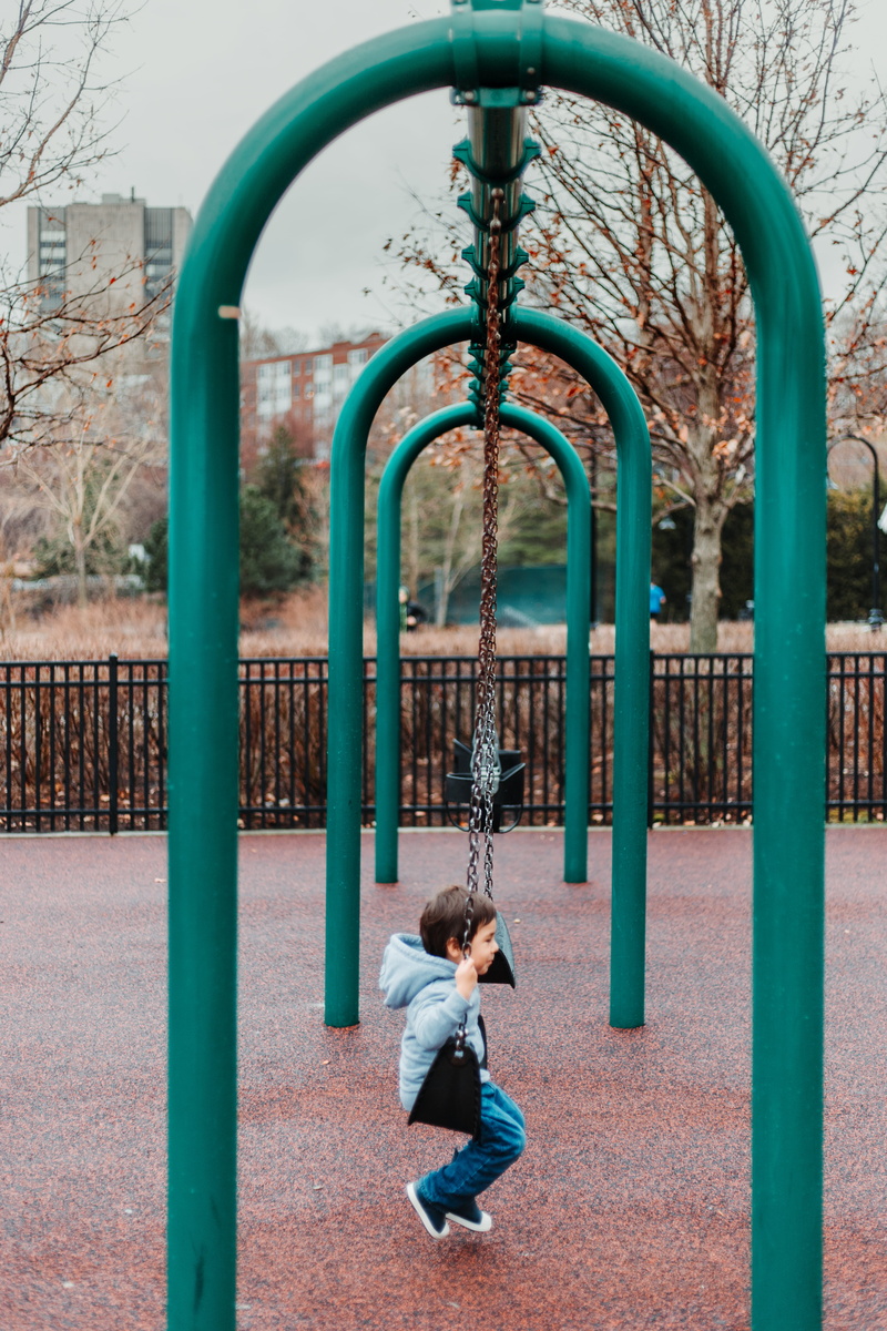 swing, park, childhood, hairstyle, girls, metal, one person, boy, park - man made space, lifestyles, sitting, full length, chair, casual clothing, leisure activity