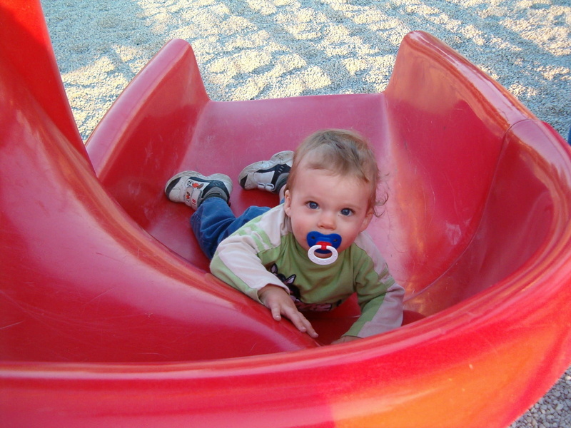 spring, people, enjoyment, lifestyles, happiness, one person, childhood, slide - play equipment, Toddler, innocence, boys, Slide, park, smiling, child
