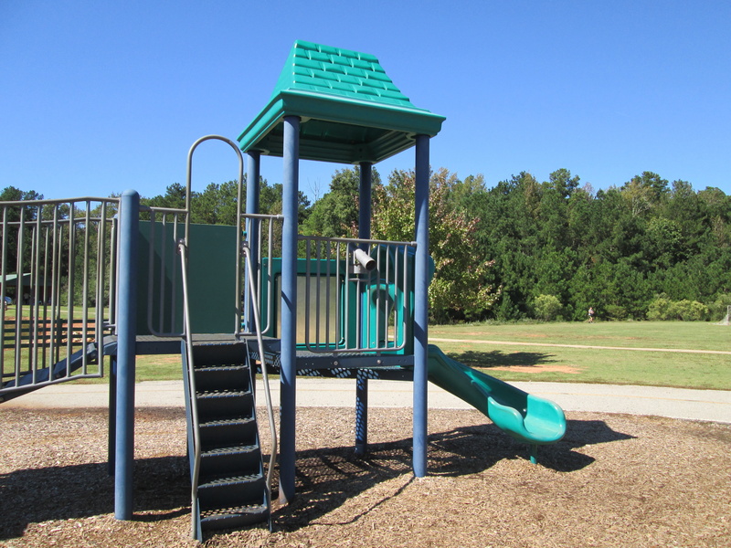 slide - play equipment, green color, day, jungle gym, plant, metal, land, recreation, playground, play, active, outdoor, ladder, sky, tree, outdoor play equipment