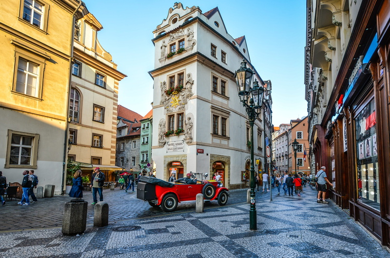 prague, town, running, people, city, transportation, motor vehicle, hotel, tourist, daytime, building exterior, skinny, cars, old, mode of transportation