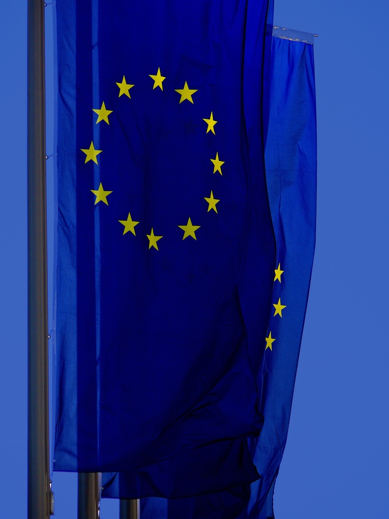 patriotism, day, europe flag, mark, clothing, flag, sky, indoors, emblem, close-up, landmark, hoisted, national emblem, recognize, country, blue background