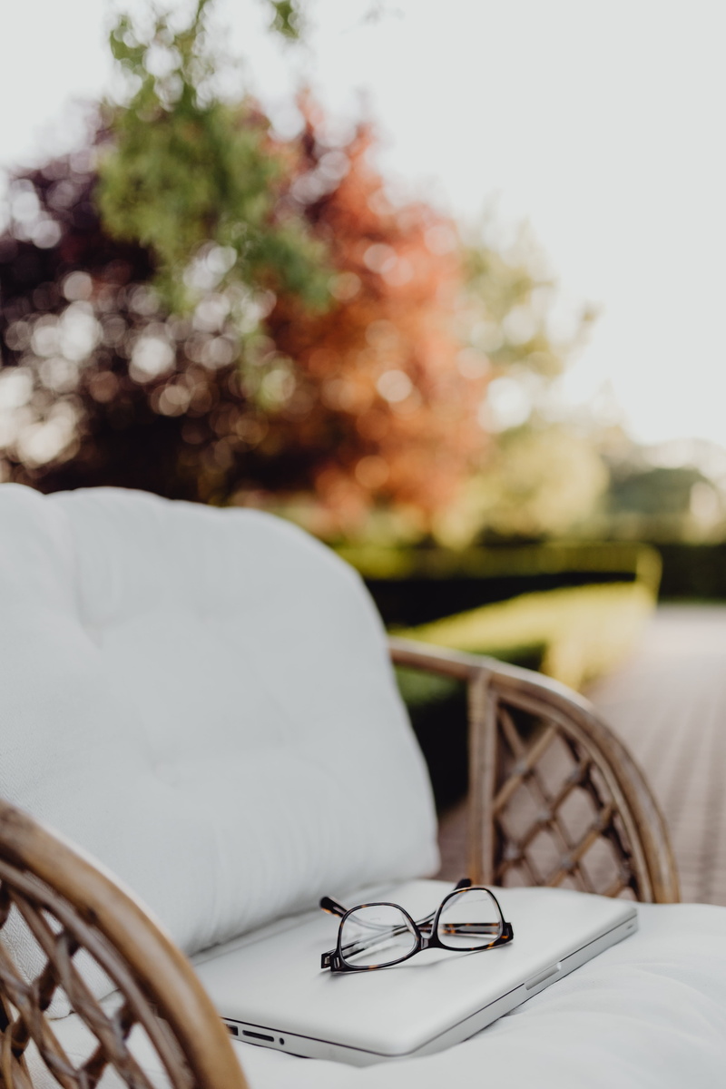 terrace, workspace, office, wicker, table, eyeglasses, absence, workplace, outdoor, macbook, focus on foreground, garden, setting, paper, 5K, textile