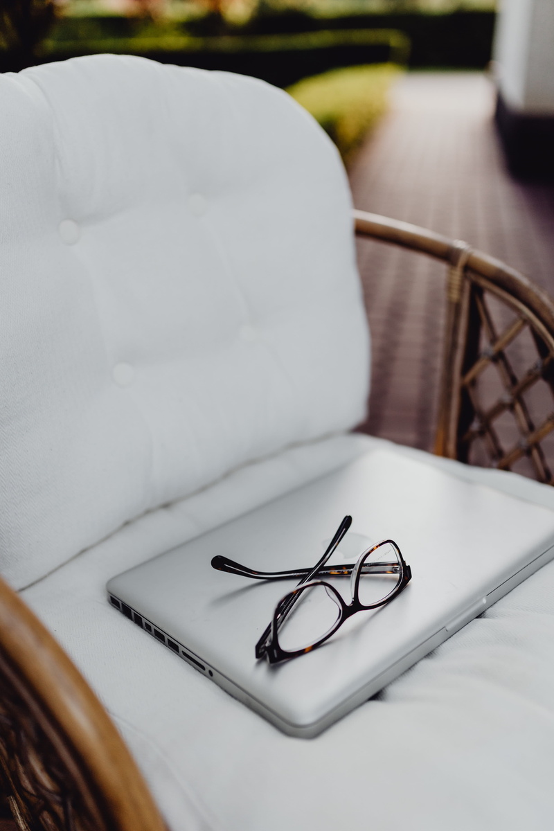 rattan, selective focus, furniture, armchair, setting, pen, terrace, pillow, 4K, indoors, no people, workspace, laptop, white color, computer, focus on foreground