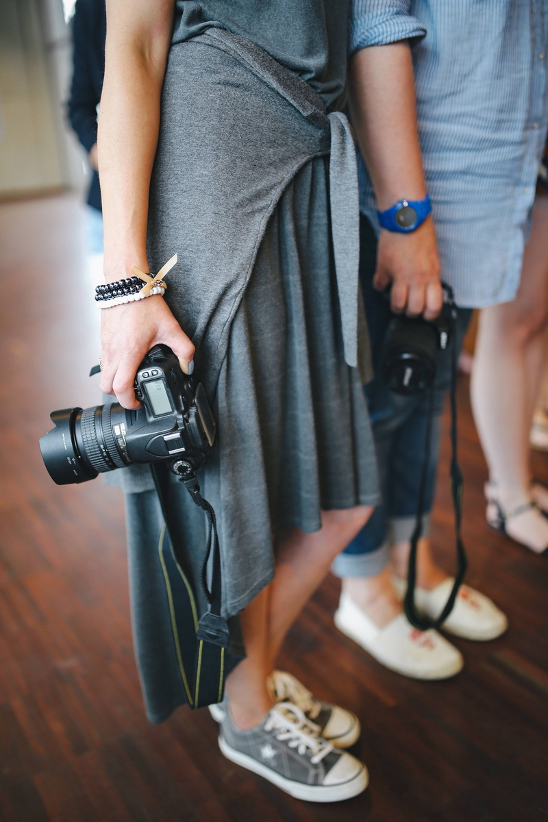 photo, human leg, females, indoors, focus on foreground, exhibition, photography, camera, People, young adult, real people, close-up, body part, human body part
