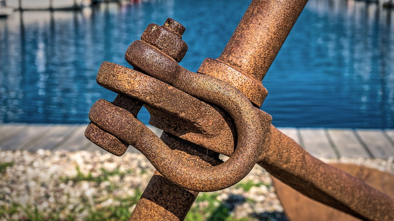 weathered, tied up, eyelet, nature, day, sunlight, focus on foreground, rust, strength, anchor, water, metal, built structure, rusted, close-up, outdoors