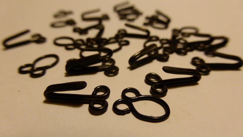 closures, text, abundance, antique, eyelets, keep, communication, selective focus, aggression, pattern, indoors, metal, western script, black, black color