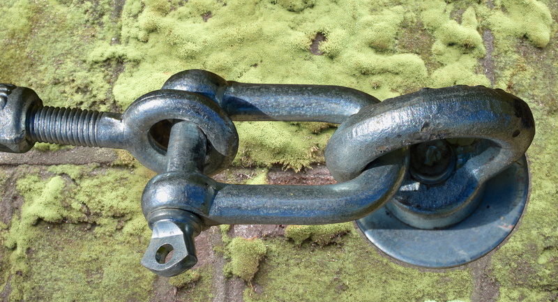 silver colored, assembly, day, high angle view, outdoors, Rope, wall - building feature, chain, field, metal, connection, material collection, screw, sunlight