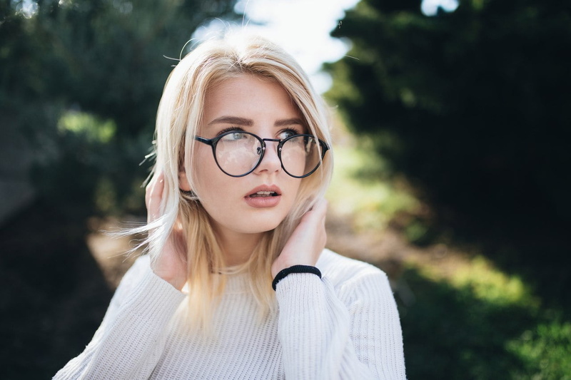 white clothing, dyed hair, glasses, straight hair, trees, open mouth, model, bracelets, forest, blonde, nature, bokeh, women, looking away, touching hair