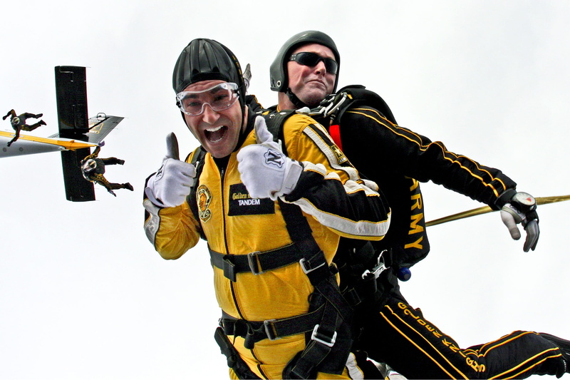man, sky, emotion, young adult, holding, clothing, standing, people, looking at camera, smiling, skydivers, diving, jumping, front view, adrenaline, portrait