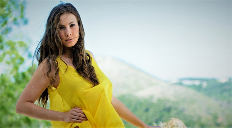 young adult, beauty, yellow, day, adult, outdoors, standing, brown hair, a Perfect 10, hairstyle, women, brunette, beautiful woman, looking at camera, hands on hips
