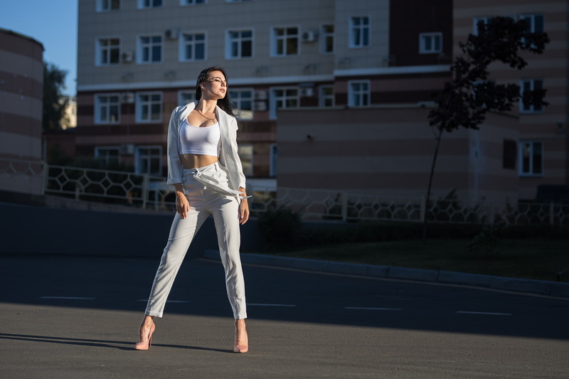 closed eyes, Dmitry Sn, high heels, full length, outdoors, 1080P, built structure, women outdoors, sunlight, young women, architecture, model, building exterior
