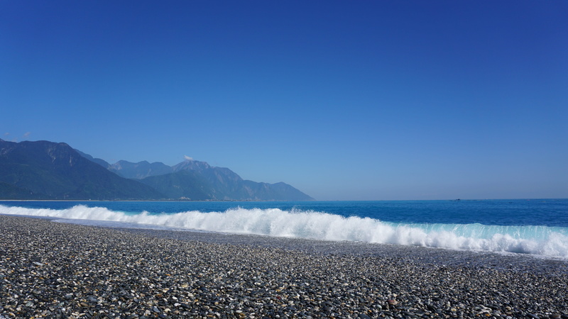 5K, beach, scenics - nature, coast, sunlight, idyllic, hualien, clear sky, water, non-urban scene, pebble, land, a birds eye view, copy space, tranquil scene