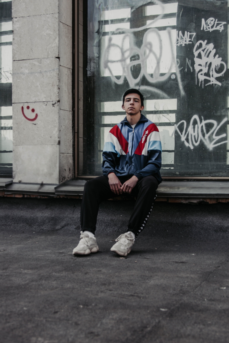 one person, shallow, graffiti, city, jacket, young adult, casual clothing, photo, young men, focus, 5K, man, emotion, full length, day, men, windbreaker