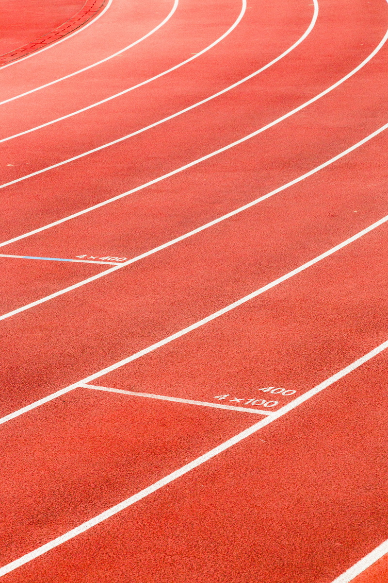 sports track, in a row, red, stadium, grass, backgrounds, pattern, day, curve, running track, no people, outdoors, track and field, competitive sport, sports race
