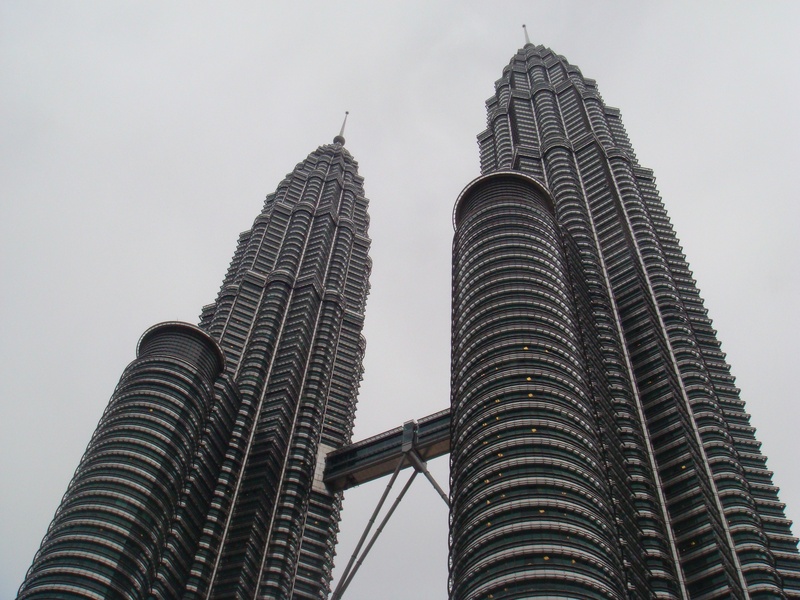 financial district, building exterior, skyscraper, modern, low angle view, petronas tower, malaysia, klcc, spire, office, built structure, day, clear sky