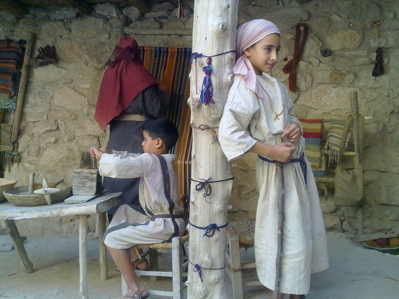 people, males, bonding, ancient, weaving, childhood, full length, child, israel, standing, pillar, females, two people, white, sister, casual clothing
