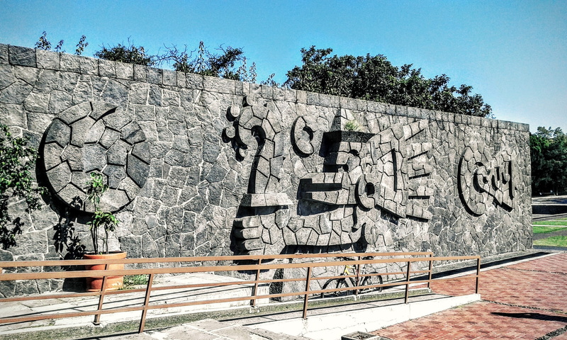 day, nature, architecture, stone material, craft, outdoors, graffiti, sign, no people, central library, built structure, text, library, art and craft, tree