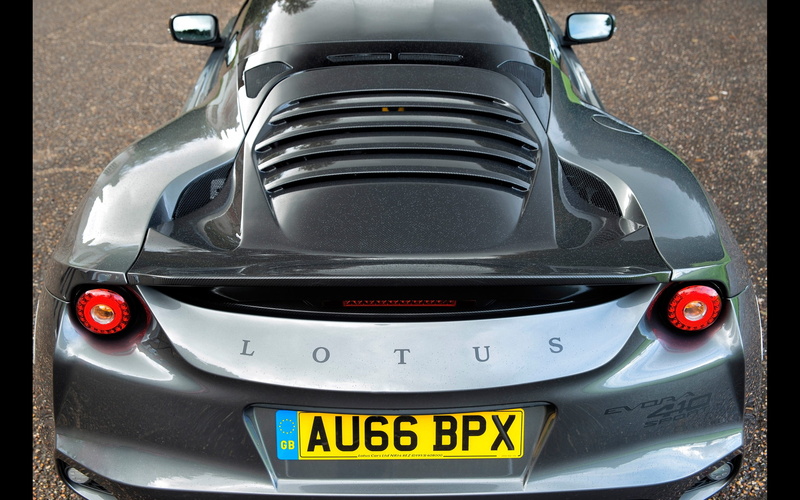 lotus, motor vehicle, high angle view, vehicle part, metal, land vehicle, outdoors, evora, text, no people, fuel and power generation, close-up, day