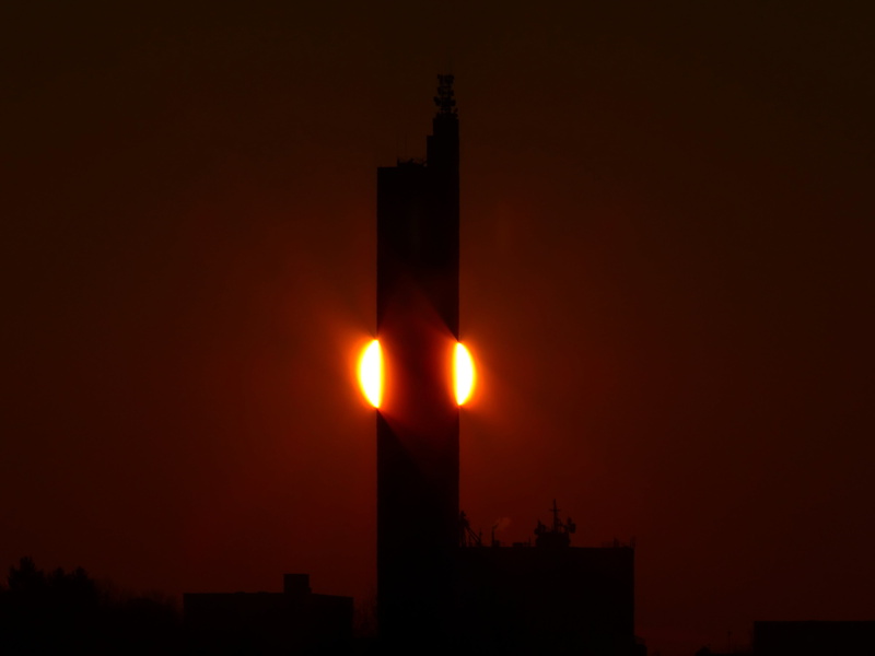 building, world record, silhouette, weird, memory, low angle view, fiery, building exterior, grain silo, silo, fireball, daytime, lighting equipment, sun