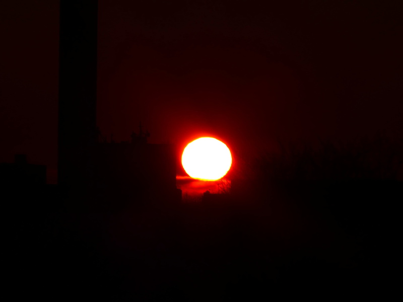 sky, outdoors, memory, circle, no people, sun, beauty in nature, black color, glowing, fireball, tranquility, solar disk, silhouette, idyllic, building