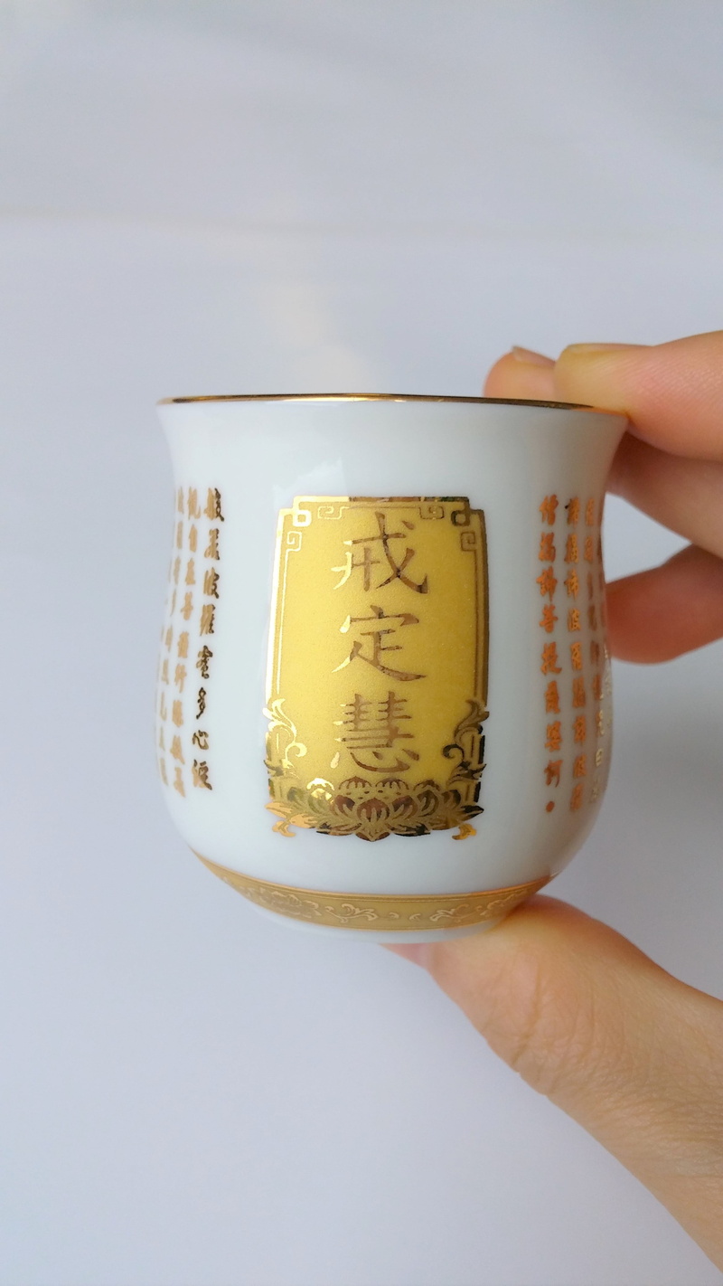 one person, offering, mug, hot drink, real people, food, tea cup, unrecognizable person, altar, buddhism, refreshment, wisdom, hand, finger, chinese, human hand