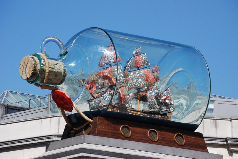outdoors, reflection, bottle, architecture, glass - material, built structure, city, london, holiday, artwork, yinka shonibare, christmas, low angle view