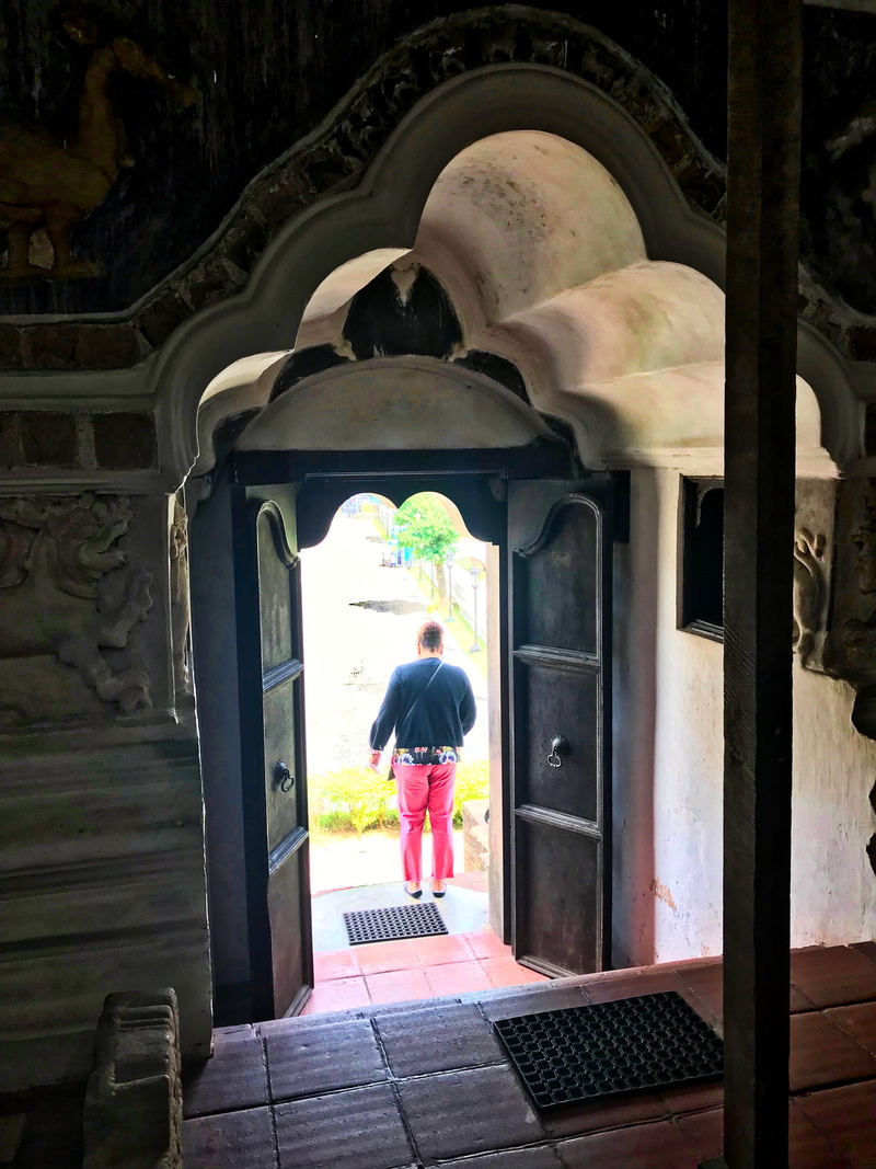 adult, arch, kandy, building, spirituality, temple square, full length, entrance, religion, rear view, outdoors, place of worship, temple, lifestyles, built structure