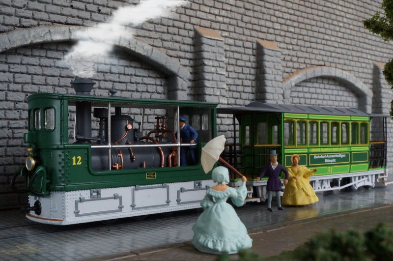 women, mode of transportation, architecture, scale h0, public transportation, real people, bern, hobby, representation, men, building exterior, model railway