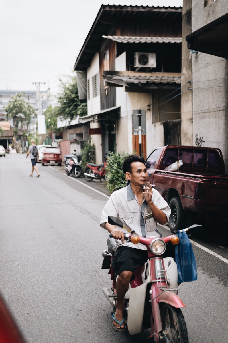 casual clothing, transportation, motor, day, motor scooter, spoke, mode of transportation, one person, lifestyles, leisure activity, outdoors, men, built structure