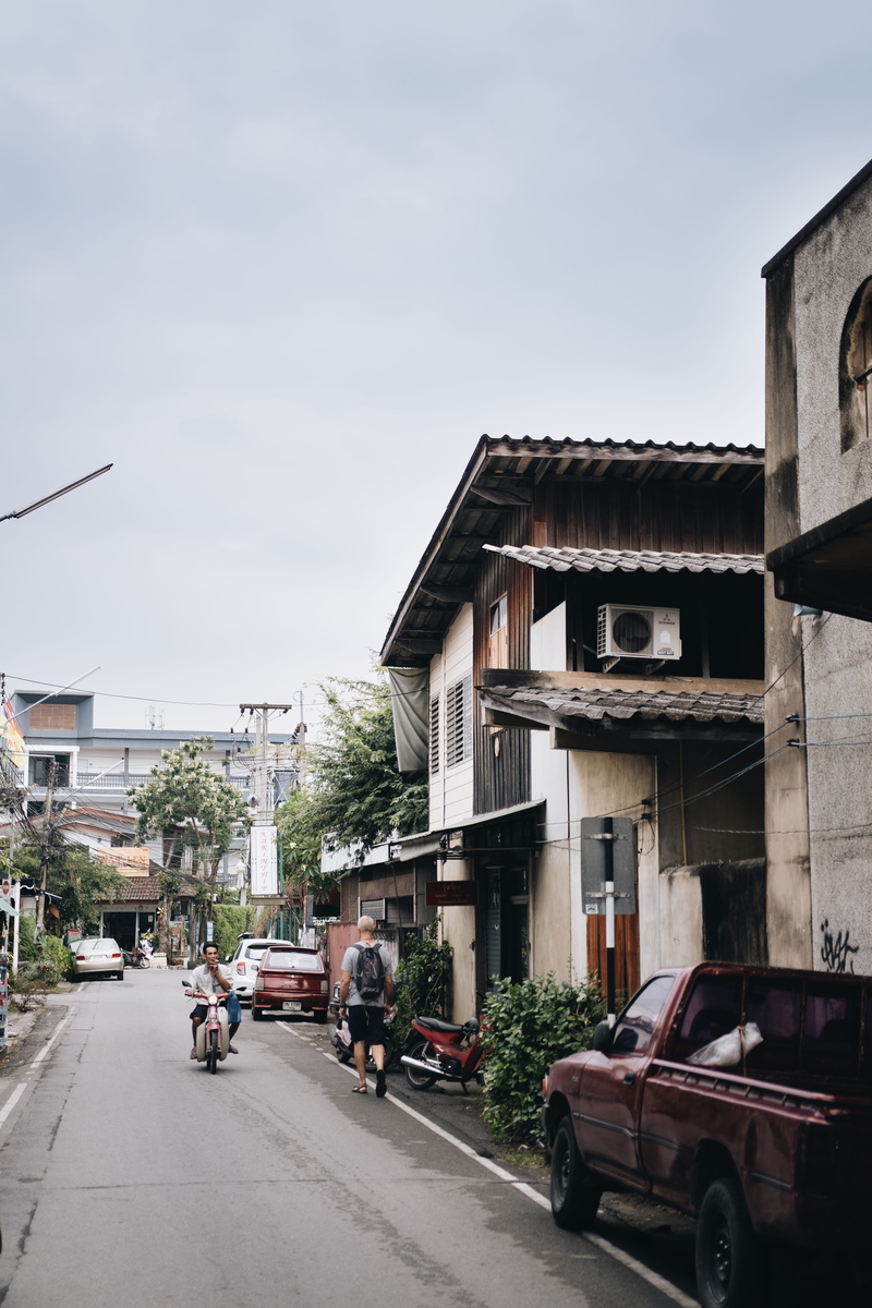 vespa, vehicle, road, building, motor scooter, automobile, architecture, residential district, riding, spire, mode of transportation, thailand, sky, tower